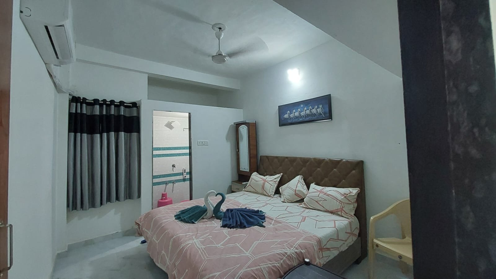 Bedroom at Madhav Homestay with double bed and air conditioning