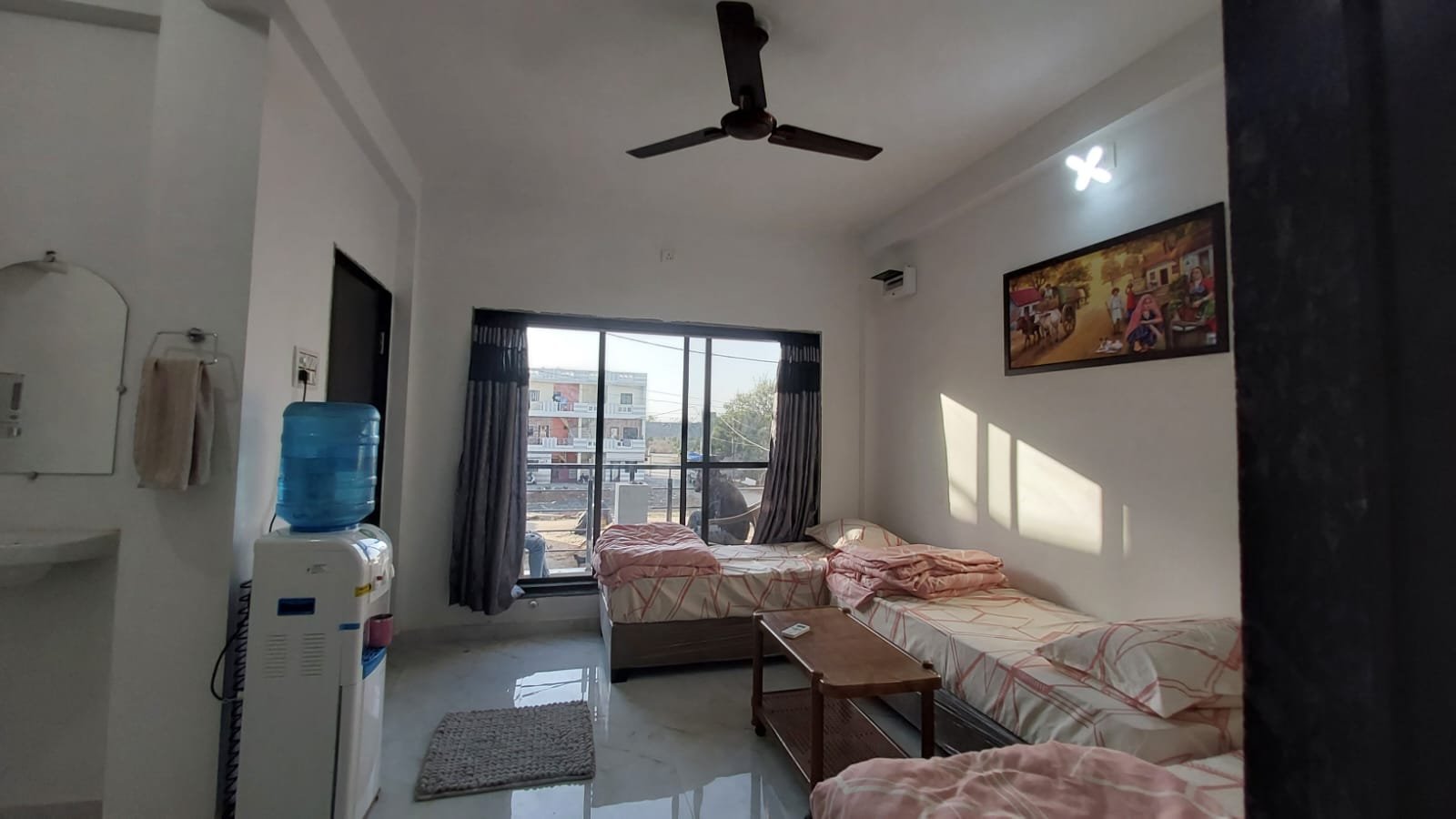 Guest room with twin beds at Madhav Homestay